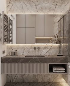 a bathroom with marble walls and flooring