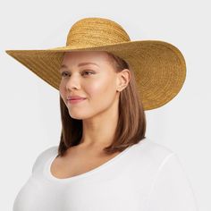 Elevate your sunny weather look with this Braided Straw Floppy Hat from A New Day™. This floppy hat features a braided woven construction for a decorative textured look. Made of midweight paper straw material, it provides a comfortable fit for all-day wear and the pull-on style makes it easy to put on or take off. Plus, the six-inch brim keeps your face shaded from the sun's rays. A New Day™: Style that goes wherever you do. Uv Protection Straw Hat With Curved Brim, Solid Color Fedora Straw Hat With Uv Protection, Solid Fedora Straw Hat With Uv Protection, Uv Protection Fedora Straw Hat, Casual Woven Straw Hat For Warm Weather, Trendy Straw Hat With Curved Brim, Casual Braided Brimmed Boater Hat, Casual Braided Boater Hat With Curved Brim, Casual Woven Hats For Warm Weather