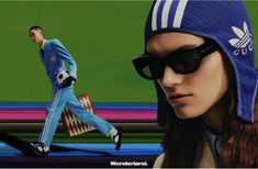 a woman wearing sunglasses and a blue hat with the image of a man walking behind her