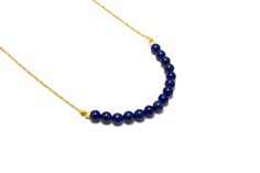 This Blue Lapis Necklace is made with a natural lapis lazuli beads and gold plated finding with a .925 Gold Vermeil chain. Check out some of our other necklaces here: https://www.etsy.com/shop/EverblissDesigns?section_id=14691610 Comes gift wrapped in a White Swirl Jewelry Box with a Organza Drawstring Bag. ----------------------------------------------------------------------------------------------- Sizing: Lapis Lazuli Beads: 6mm Gold Finding: 3mm Necklace Length: 21 inches ------------------ Gold Necklaces With Lapis Lazuli Gemstone Beads, Gold Necklace With Lapis Lazuli Gemstone Beads, Gold Lapis Lazuli Necklaces For Jewelry Making, Gold Lapis Lazuli Necklace With Gemstone Beads, Minimalist Blue Lapis Lazuli Necklace, Minimalist Lapis Lazuli Blue Necklace, Gold Lapis Lazuli Jewelry With Polished Beads, Lapis Necklace, Lapis Lazuli Beads