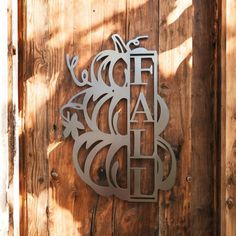 a wooden door with metal letters on it