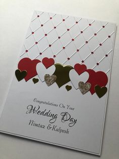 a wedding card with hearts on it