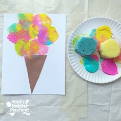 a paper plate with ice cream and flowers on it next to a card that says happy mother's day