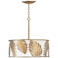 a gold leaf chandelier hanging from a ceiling fixture with white and gold shades