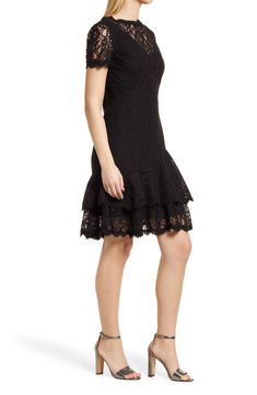 A lacy overlay adds stylish definition to an elegant and sophisticated cocktail dress styled with a ruffled skirt and pretty scalloped details. 38" length Hidden back-zip closure Bateau neck Short sleeves Lined 70% cotton, 30% nylon Dry clean Imported Women's Clothing Evening Fitted Lace Dress With Scalloped Edges, Fitted Lace Dress With Scalloped Edges For Evening, Elegant Tiered Lace Dress With Ruffle Hem, Elegant Fit And Flare Mini Dress With Lace Trim, Formal Fit And Flare Lace Dress, Fitted Lace Dress With Scalloped Edges For Party, Knee-length Scalloped Lace Dress For Date Night, Scalloped Lace Knee-length Dress For Date Night, Feminine Scalloped Lace Dress For Night Out