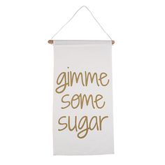 a white banner with the words gimme some sugar hanging from it's side