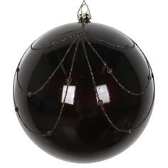 a black ornament hanging on a white background