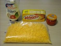 ingredients to make cheese pizza on a table