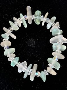 Beautiful Northumbrian Sea Glass and Crystal Bead Stretch Bracelet, length 18cm. Unique, natures recycling, hand made from Sea Glass washed up and collected from the beaches of Northumberland. The beads are all recycled from broken jewellery. Sustainable and Eco-Friendly. Beaded Stretch Bracelet, Stretch Bracelet, Stretch Bracelets, Sea Glass, Arm Band, Crystal Beads, Wedding Gifts, Jewelry Bracelets, Recycling