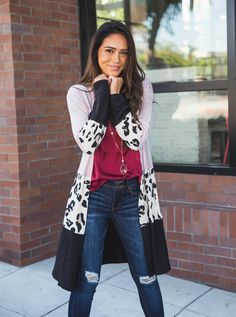 We're taking animal print to the next level with a pop of color! Our Briana cardigan is the best way to dress up old jeans and your everyday basics! Its super soft material and color block style will easily complete your look in a snap. Size Small 0-4 Medium 6-8 Large 10-12 XL 12-14 Models are 5'4" & 5'5" are wearing small. Trendy Black Color Block Cardigan, Trendy Leopard Print Cardigan For Fall, Trendy Spring Leopard Print Cardigan, Trendy Leopard Print Spring Cardigan, Casual Leopard Print Outerwear For Layering, Colorblock Cardigan, Color Block Cardigan, Maxi Skirt Dress, Block Style