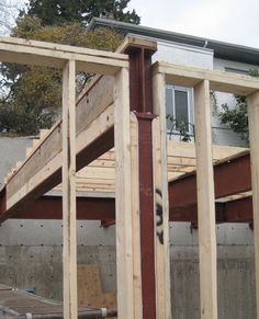 the inside of a house being built with wooden framing and wood floor joisting