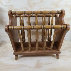 an old wooden chair with wood slats on it