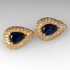 These gorgeous sapphire earrings are each centered with a pear cut sapphire in a four-prong setting. The center is accented by forty (40) bead set, round brilliant cut diamonds. The earrings measure 18.9mm long by 13.6mm wide and 6.2mm deep, finished with omega style clip on backs. We can add a post for pierced ears if you prefer. Elegant Blue Pear-shaped Diamond Earrings, Blue Teardrop Diamond Earrings For Anniversary, Formal Sapphire Diamond Earrings With Diamond Accents, Elegant Sapphire Diamond Earrings For Formal Occasions, Formal Blue Pear-shaped Diamond Earrings, Blue Pear-shaped Diamond Earrings For Anniversary, Classic Teardrop Jewelry With Gemstone Accents, Formal Sapphire Earrings With Sparkling Stones, Classic Teardrop Gemstone Jewelry