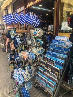 an outdoor market with umbrellas and books on display