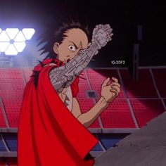 an animated image of a man in a red cape pointing at something on the ground