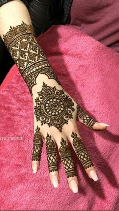 henna tattoo on the arm and hand