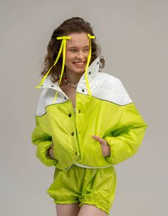 Jacket is made of raincoat fabric, has a lightweight insulation and a high collar, as well as a button closure and sleeves with hidden elastic. Among its special features is a reflective stripe along the yoke, which provides safety and visibility in the dark, as well as pockets that add convenience and functionality. The jacket is very lightweight and comfortable, making it ideal for use in the transitional seasons, when the temperature is not cold enough to wear heavy winter jackets. Available Winter White Outerwear With Reflective Details, White Reflective Winter Outerwear, Winter Outdoor Track Jacket With Reflective Details, Functional Green Puffer Jacket With Long Sleeves, Functional Green Long Sleeve Puffer Jacket, Winter Outdoor Outerwear With Reflective Details, Winter Outerwear With Reflective Details For Outdoor, Winter Reflective Long Sleeve Windbreaker, Reflective Long Sleeve Winter Windbreaker