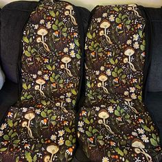 two seat covers with mushrooms and flowers on them