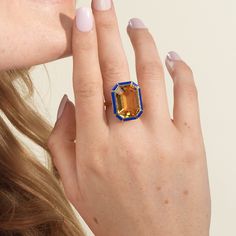 JR0365-CT 'Mélange' Citrine with Tiger's Eye & Lapis Lazuli Inlay Emerald Cut Ring in 18K Gold Stone Size: 19.2 x 14.2 mm Approx. Stone Wt: (Citrine) 14.65 Carats Emerald Cut Ring, Emerald Cut Rings, Design Board, Citrine Stone, Gold Stone, Pendant Rings, Tiger's Eye, Ring Collections, Emerald Cut