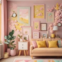 a living room with pink walls and pictures on the wall, flowers in vases