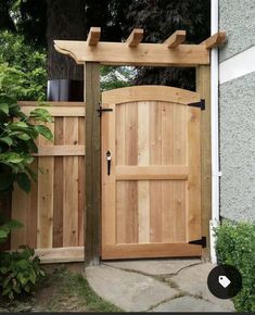 a wooden gate with an arched top