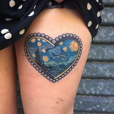 a woman's thigh with a heart shaped painting on it and stars in the sky