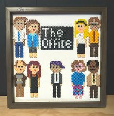 this is an image of a cross - stitch frame with people in pixel art style