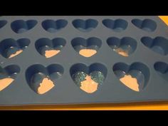 a close up of an ice tray with hearts on it