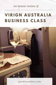 an airplane cabin with wine glasses on the counter