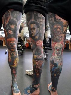 the legs and ankles of a man with many different tattoos on his body, all covered in