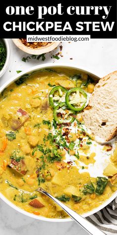 one pot curry chickpea stew in a white bowl with bread on the side