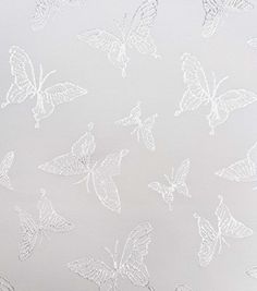 a white wallpaper with many butterflies on the back and side of it, as well as