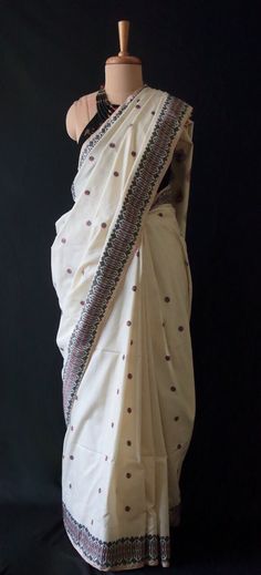 Handwoven silk saree from our looms in Assam , India .  All yarns are either natural dyed using locally available plant dye extracts or are in their natural colours. The off white colour of the saree is the natural colours of the yarns. The saree has  Mulberry Spun Silk in the warp and Eri silk in the weft and all the interwoven motifs in Eri Silk  making this saree a hundred percent silk saree. Spun silks are produced from cocoons waste or pierced cocoons . Hence they are always spun and do not Traditional Pre-draped Cream Saree, Traditional Off White Chanderi Pre-draped Saree, Traditional Cotton Pre-draped Saree With Zari Work, Traditional Pre-draped Saree In Cream, Traditional Cream Pre-draped Saree, Traditional Cream Saree Blouse Piece, White Tussar Silk Saree With Woven Motifs, Bohemian Cotton Saree With Cutdana, Traditional Off White Raw Silk Saree