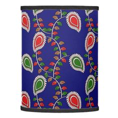 a blue canister with red and green designs on it