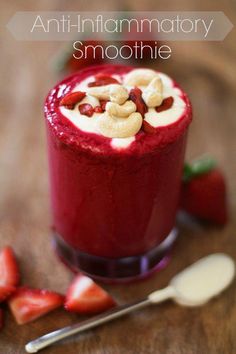 a smoothie with strawberries and nuts in it