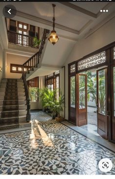 the inside of a house with stairs and tiled floors