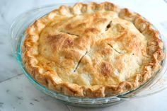 a pie sitting on top of a glass plate