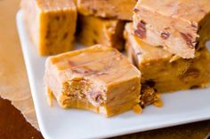 several pieces of peanut butter fudge on a white plate