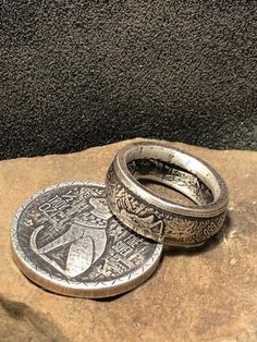 This Egyptian .999 Pure Silver Round Half Double Sided Coin Ring Is Hand Crafted with Great care and detail. This Awesome item is very unique and each individual Ring will be different due to the Crafting process. Please contact us with your preferred finish in the remarks of your order- either Antiqued Patina or High Silver Polish. We also offer this ring in sizes 6 to 12; which you can choose as you are completing your purchase. This Collectable is Silver It will not cause discoloration; Howev Artisan Stamped Rings As Collectibles, Unique Stamped Antique Silver Rings, Unique Engraved Round Ring, Silver Etched Round Ring, Unique Engraved Ring For Collectible, Silver Stamped Rings, Artisan Engraved Hallmarked Ring, Antique Silver Hallmarked Engraved Ring, Egyptian Cat