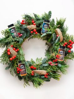 a christmas wreath with pine, berries and spices