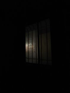 an open window at night in the dark