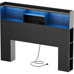 a computer desk with a blue light under it