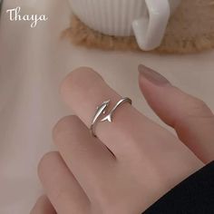 Embrace the timeless allure of our Silver Dolphin Ring. With its enchanting symbolism, this exquisite piece captures the grace and beauty of these magnificent creatures. Radiating elegance and style, it's a perfect accessory for those seeking a truly unique and meaningful adornment.   - Brand: Thaya  - Material: 925 Silver  - Style: Dolphin  - Gender: Women    Open ring, adjustable, size for reference    Women's rings are suitable for the United States Size: 6-7, the inner diameter is about 16.5 Gold Cleaner, Dolphin Fish, Silver Cleaner, Women's Rings, Fish Tail, Loose Stones, Finger Rings, Silver Style