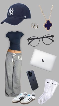 a woman's clothing and accessories are arranged in the shape of an apple computer