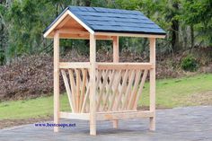 a small wooden structure with a blue roof