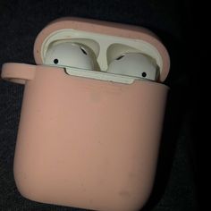 an apple airpods case sitting on top of a table