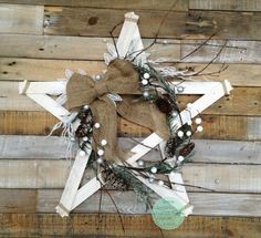 a christmas wreath on top of a wooden wall