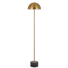 a gold floor lamp with a black base and a white light on the top of it