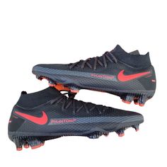 a pair of black and red soccer shoes