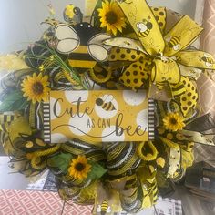 a yellow and black wreath with sunflowers on it